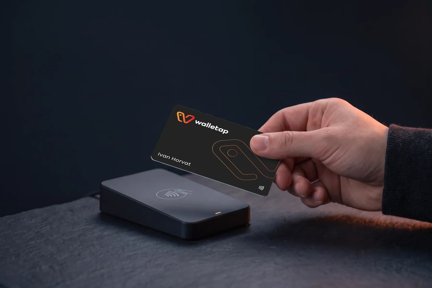 Printed NFC card held over a desktop reader